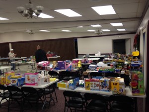 The tables loaded with toys ready to provide smiles on Christmas morning!