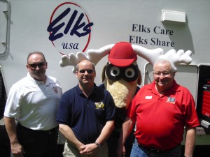 Pictured from left:  Marshalltown Fire Chief David Rierson, President Roger McQueen, Elroy Elk and President-Elect Bob Streeter