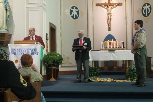 Iowa Elks Association President Roger McQueen addresses the large crowd gathered to honor Austin Perrin.